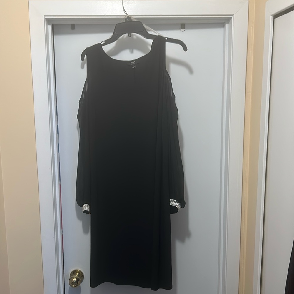 Beautiful elegant knee length dress. With rhinestone cuffs